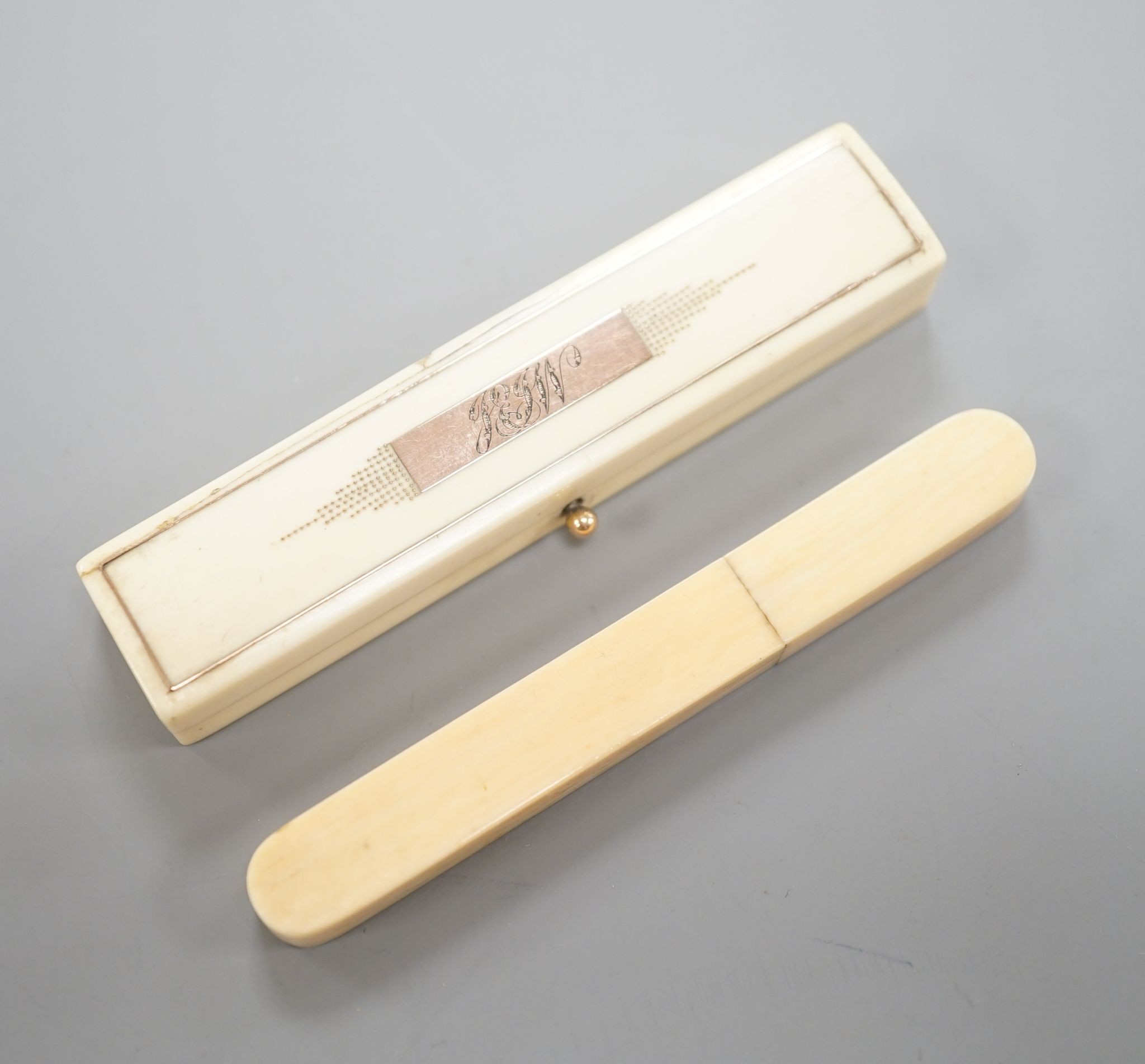 A yellow metal inset ivory tooth pick case and an Ivory needlecase 8cm